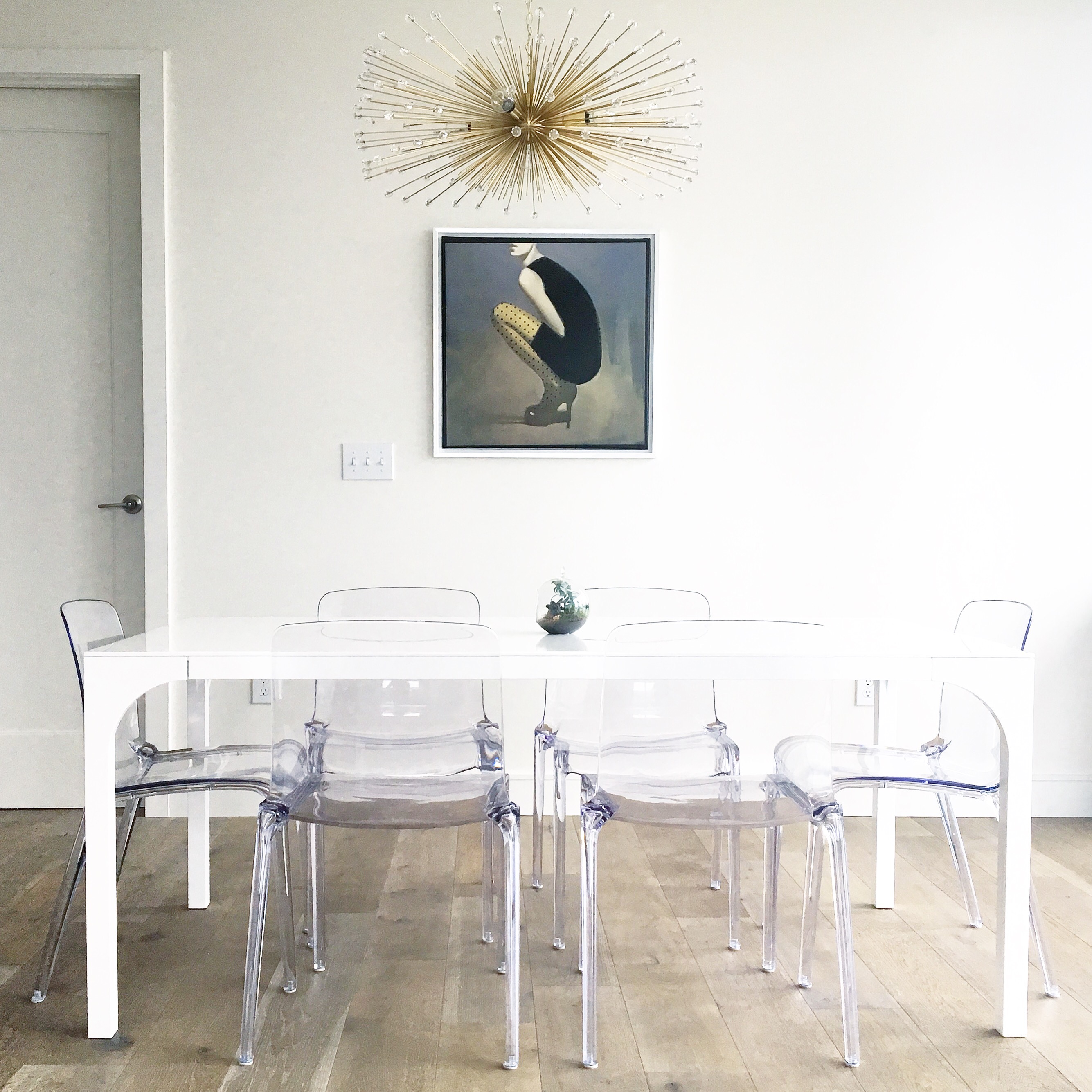 ghost-chairs-urchin-chandelier-lacquer-table-cb2-duttonbrown