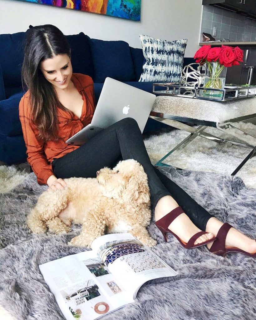 style-beacon-michelle-kuta-zuzek-fashion-blogger-and-blog-dog-poodle-puppy-in-home-style-bella-dahl-hipster-shirt-hudson-krista-super-skinny-jeans-in-noir-coated-ted-baker-chablise-burgandy-heels-gus-modern-margot-sofa-mod-lifestyles-tie-dyed-embroidery-cotton-throw-pillow-faux-fur-throw-blanket-sunpan-sahara-cowhide-bench